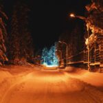 night winter road with light in end